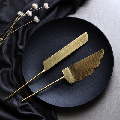 gold cake server and knife