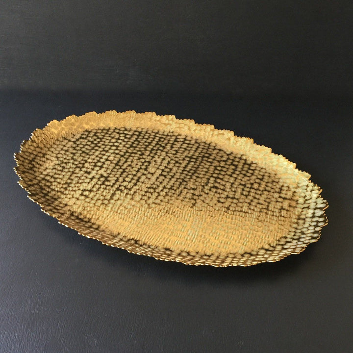 gold oval metal serving tray