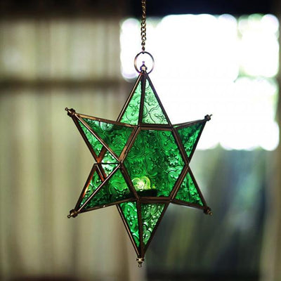 star shaped brass and glass green t light holders