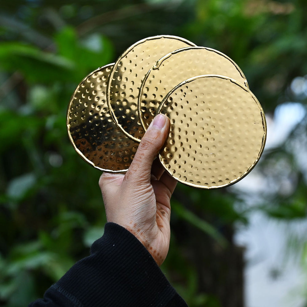 gold round metal coasters set