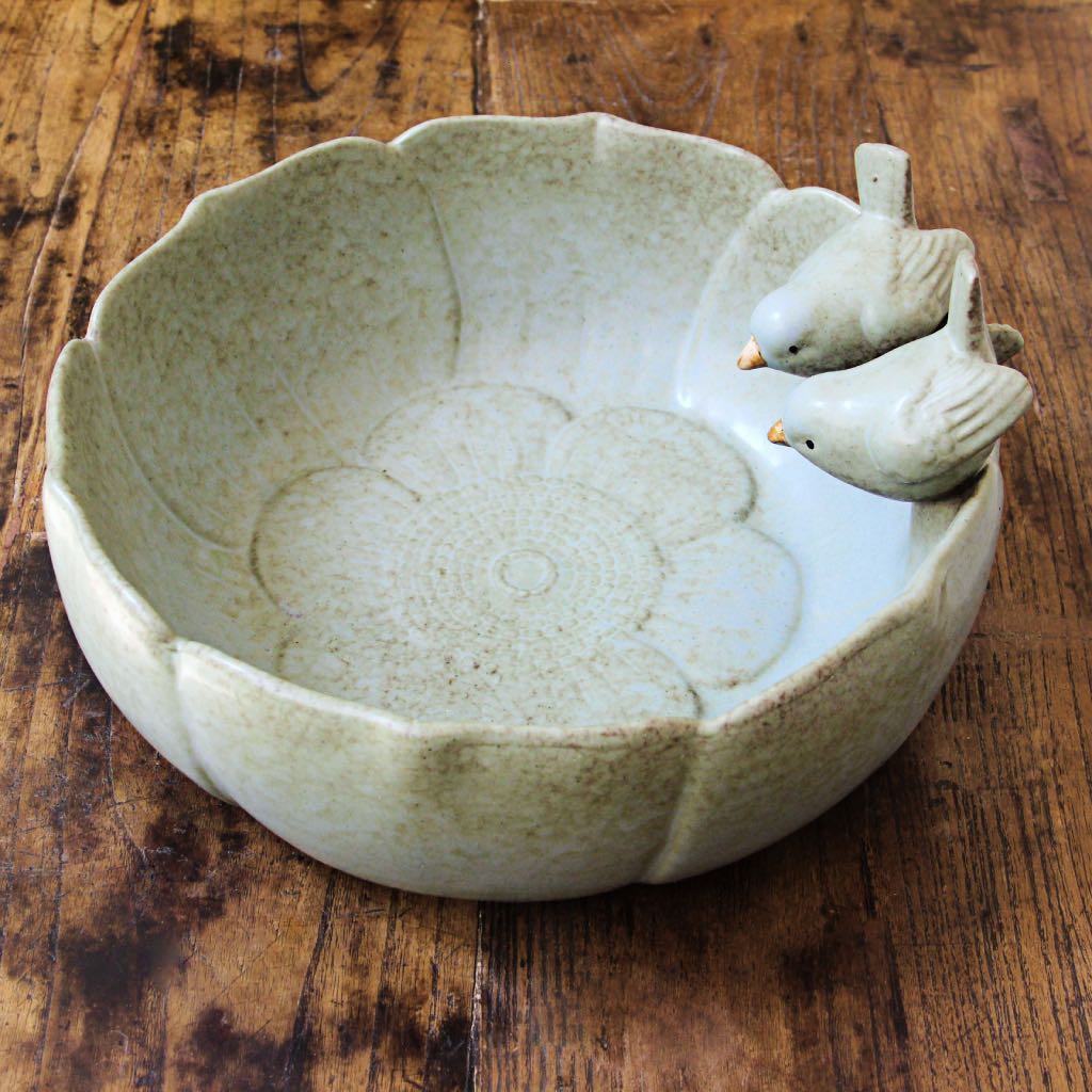 pale green ceramic bowl with birds