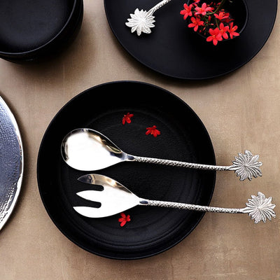 steel serving cutlery with palm-leaf shaped handles