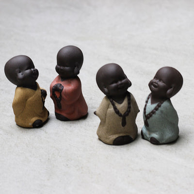 ceramic monk figurine set
