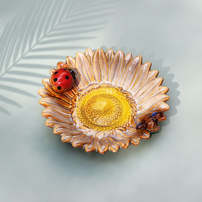 ceramic dish with a sunflower design