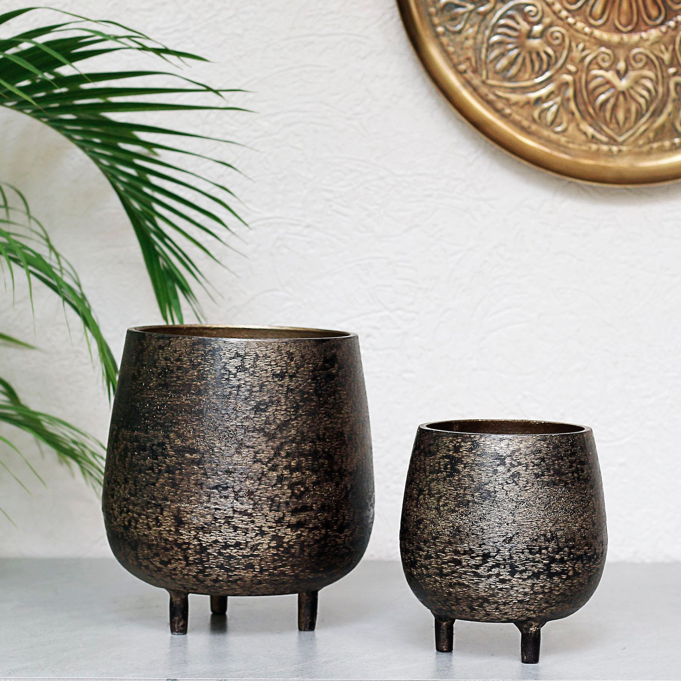 brown metal planters with legs