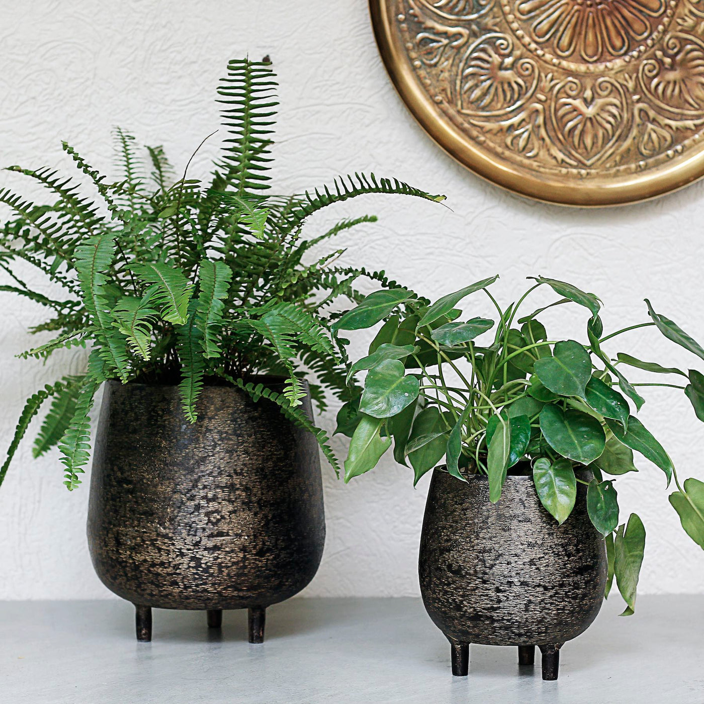brown metal planters with legs