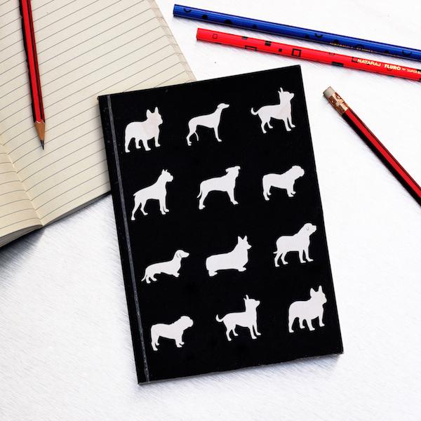black notebook with dog artwork