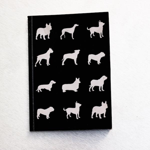 black notebook with dog artwork
